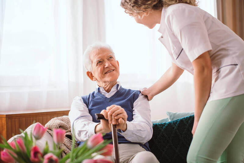 Caregiver talking to senior